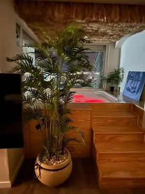 a room with a large pot with plants in it at Suite 69 in Hurghada