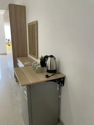 a kitchen with a counter with a coffee maker on it at Lilly Stays Sheraton Road in Hurghada