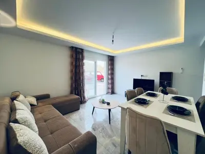 a living room with a couch and a table at Selina Apartments in Hurghada