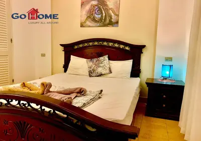 a bedroom with a bed with a teddy bear on it at 1 Bed Room West Golf at El-Gouna Y12-0 in Hurghada