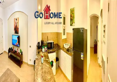 a kitchen with a black refrigerator and a counter at 1 Bed Room West Golf at El-Gouna Y12-0 in Hurghada