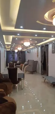 a waiting room with couches and chairs in a building at Aswan Nile view palace in Naj‘ al ‘Amrāb