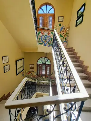 a staircase in a home with a mosaic stair case at Villa Belzoni in Luxor