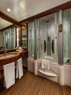 a bathroom with a tub and a shower and a sink at Sonesta St George Nile Cruise - Luxor to Aswan 4 Nights from Monday to Friday in Luxor