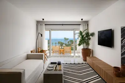 a living room with a couch and a table at Serry Beach Resort in Hurghada