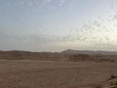 a view of the desert with mountains in the background at Royal Mountain in Luxor
