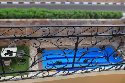 a iron railing on a balcony with a view at Royal Mountain in Luxor