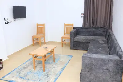 a living room with a couch and a table at Royal Mountain in Luxor