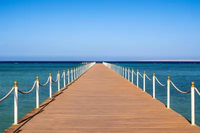 a wooden pier stretches out over the water at Scandic Resort in Hurghada, EGYPT in Hurghada
