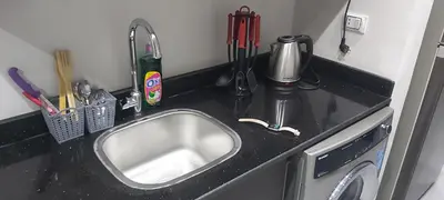 a kitchen counter with a sink and utensils at Scandic Resort: Comfy & Cozy. A433 in Hurghada