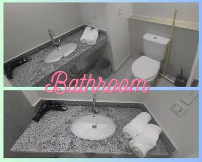 a bathroom with two sinks and a toilet at Scandic Resort: Comfy & Cozy. A433 in Hurghada