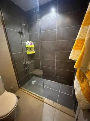 a bathroom with a shower with a toilet at Brand new studio at G-Cribs ElGouna in Hurghada