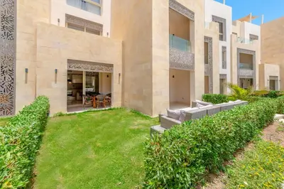 an empty yard in front of a building at Cozy 1-Bedroom Apartment in Mangroovy, El Gouna. Private terrace, garden and pool access in Hurghada