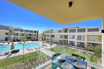 a view of the pool from the balcony of a apartment at Refreshed & Uplifted 2 BDR G Cribs in Hurghada
