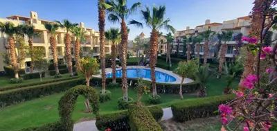 a view of a resort with palm trees and a swimming pool at veranda sahl hasheesh resort in Hurghada