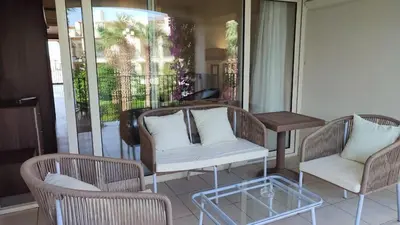 a patio with two chairs and a table and a couch at veranda sahl hasheesh resort studio in Hurghada