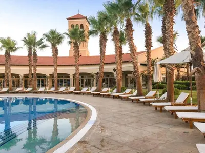 a resort with palm trees and a swimming pool at veranda sahl hasheesh resort studio in Hurghada