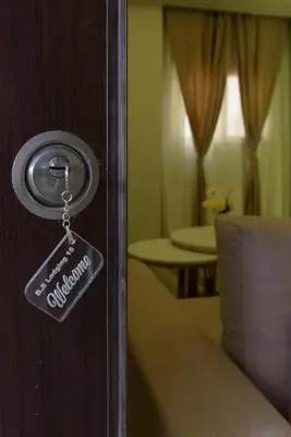 a door opener with a tag on a bedroom door at BS Lodging 15 - Next to Dream Beach in Hurghada
