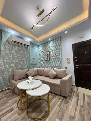 a living room with a couch and a table at BS Lodging 15 - Next to Dream Beach in Hurghada