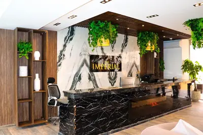 a lobby of a hotel with a marble wall at 2 Bed Resort Apt-Sleeps 4-Balcony-Hotel Services in Hurghada