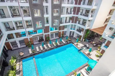 an overhead view of a swimming pool in an apartment building at 2 Bed Resort Apartment - Sleeps 4 - Hotel Services in Hurghada