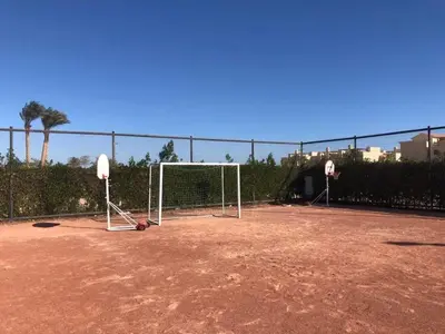 a soccer field with a goal and a fence at شقه غرفتين وصاله بالحديقه في فراندا سهل حشيش in Hurghada