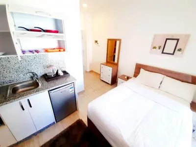a small bedroom with a bed and a sink in it at One bedroom apartment in Aqua palm resort before Al Gouna in Hurghada