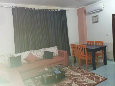 a living room with a couch and a table at Abeer Suites 3 basement in Hurghada