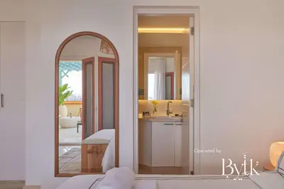 a living room with a mirror and a sink at BYTK - La Veranda in Hurghada