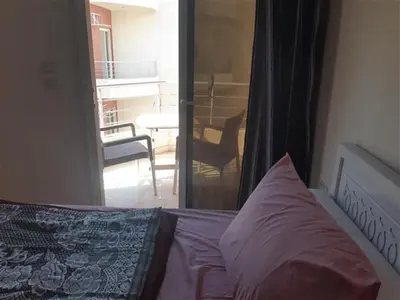 a bedroom with a bed and a view of a balcony at Chalet in Casablanca Beach Resort in Hurghada