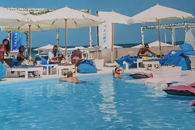 a group of people in a swimming pool at Amazing 2 bedroom Selena Bay Hurghada in Hurghada