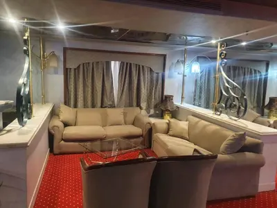 a living room with a couch and a table at Nile Cruise Aswan & Luxor & Abu Simbel in Luxor