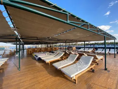 a deck of a boat with lounge chairs on it at Nile Cruise Aswan & Luxor & Abu Simbel in Luxor