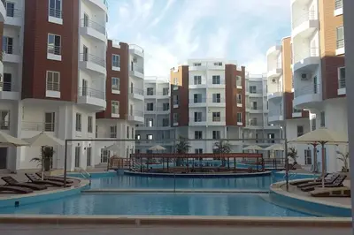 a swimming pool in the middle of a apartment complex at A Superb Studio Apartment in Hurghada