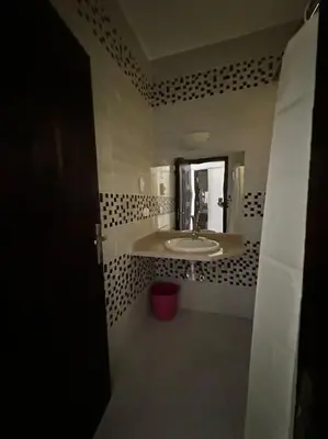 a bathroom with a sink and a mirror at Уютное место рядом с променадом in Hurghada