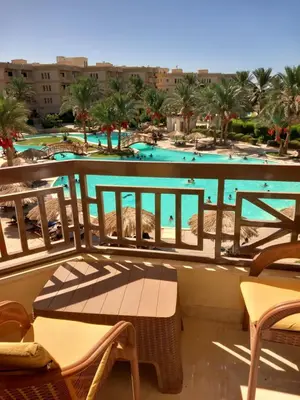 a view of the pool from the balcony of a resort at Palma Resort Hurgáda,8P4J22Q, Hurgada Palma Resort, apartment K75, Al Ismaileya, in Hurghada