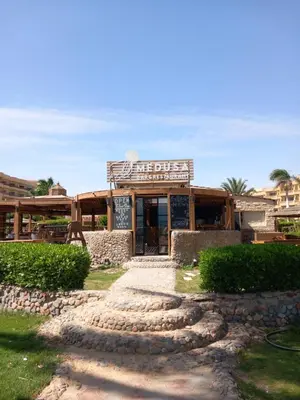 a building with a sign that reads the bites at Palma Resort Hurgáda,8P4J22Q, Hurgada Palma Resort, apartment K75, Al Ismaileya, in Hurghada
