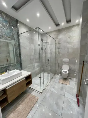 a bathroom with a shower and a toilet and a sink at Hurghada-Magawish Villa 1 in Hurghada