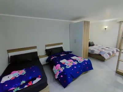 a bedroom with two beds and a bedskirts at Scandic Cinde in Hurghada