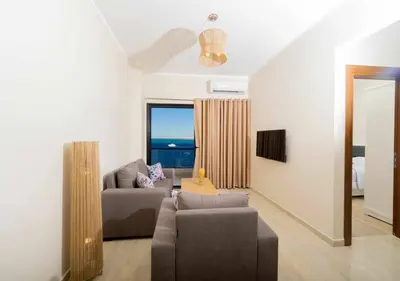 a living room with a couch and a table at BLUE ViEW SUiTES in Hurghada