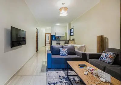 a living room with a couch and a table at BLUE ViEW SUiTES in Hurghada