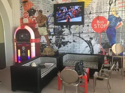 a living room with a couch and a bus stop wall at Hurghada Makadi Heights in Hurghada