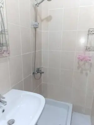 a bathroom with a shower and a toilet and a sink at Hurghada Makadi Heights in Hurghada