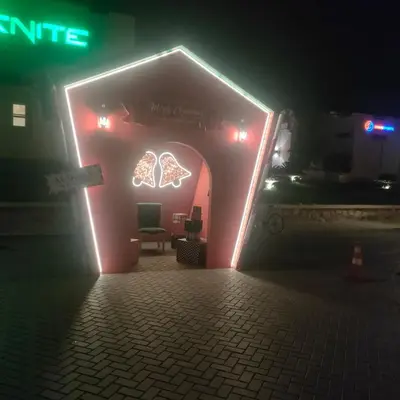 a building with neon lights in the dark at Hurghada Makadi Heights in Hurghada