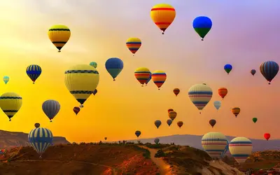 a bunch of hot air balloons flying in the sky at Royal Home Luxor Nile View in Luxor