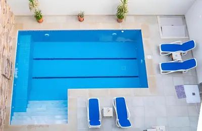 an overhead view of a swimming pool in a house at Royal Home Luxor Nile View in Luxor