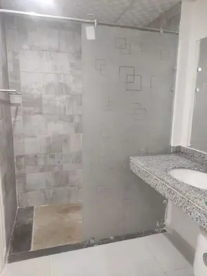 a bathroom with a shower and a sink at Scandic Resort - Mido Chalet in Hurghada