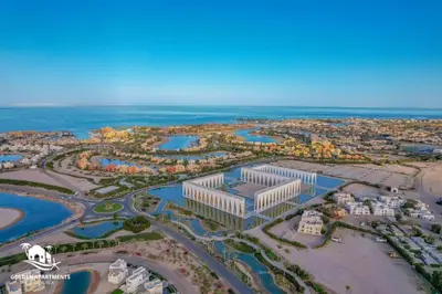 an aerial view of a city with the ocean at New! Lovely 1BR in Swan Lake, Gouna. Azure Lagoon in Hurghada
