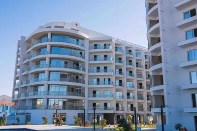 a large white building with a lot of windows at شاليه السعادة in Hurghada