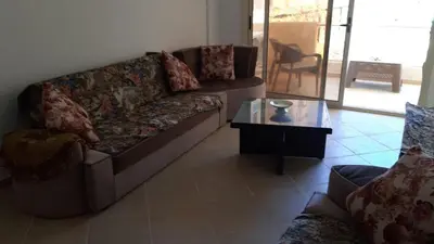 a living room with a couch and a coffee table at casa di nonna in Hurghada